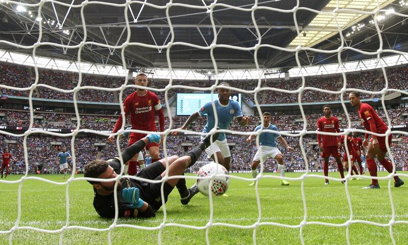 Soccer Football - FA Community Shield - Manchester City v Liverpool - Wembley Stadium, London, Britain - August 4, 2019  Manchester City's Raheem Sterling scores their first goal as Liverpool manager Juergen Klopp looks dejected   REUTERS/David Klein