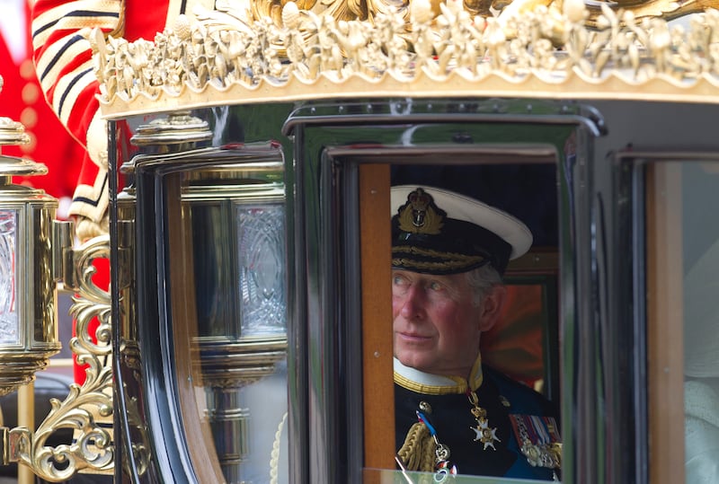 Britain's then Prince of Wales, now King Charles III, rides in a carriage to Buckingham Palace in London. AP