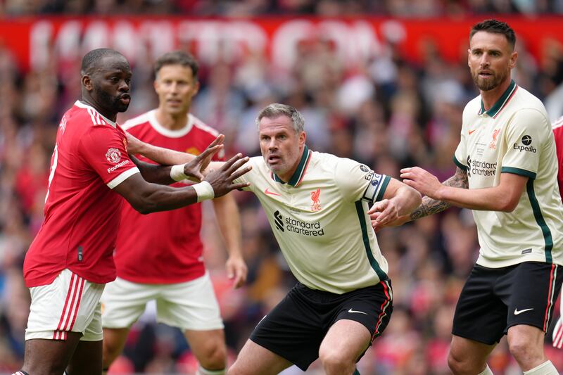 United's Louis Saha and Liverpool's Jamie Carragher during the Legends match at Old Trafford. PA