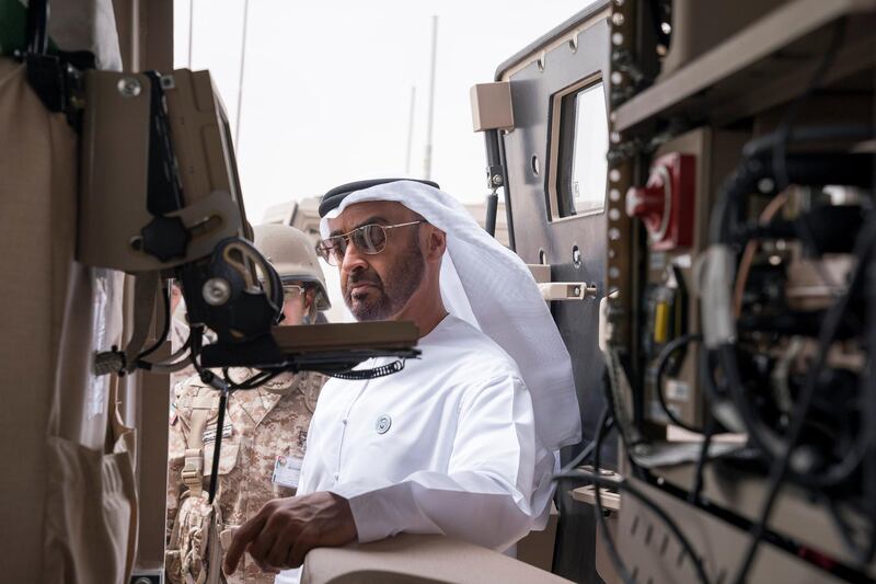 AL DHAFRA REGION, ABU DHABI, UNITED ARAB EMIRATES - April 08, 2018: HH Sheikh Mohamed bin Zayed Al Nahyan, Crown Prince of Abu Dhabi and Deputy Supreme Commander of the UAE Armed Forces (C), inspects a vehicle, at Al Hamra Camp, prior to a military exercise titled ‘Homat Al Watan 2 (Protectors of the Nation)’.
 ( Mohamed Al Hammadi / Crown Prince Court - Abu Dhabi )
---