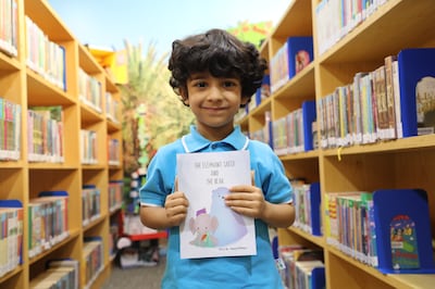 Saeed Rashed AlMheiri, 4, with his book titled 'The Elephant Saeed and the Bear'. Nilanjana Gupta / The National