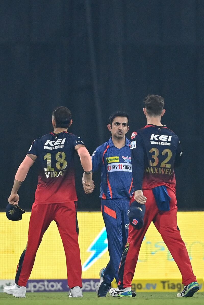 Lucknow Super Giants' team mentor Gautam Gambhir greets Royal Challengers Bangalore's Virat Kohli after the match. Both were fined 100 per cent of their match fees by the IPL following a heated exchange shortly after. AFP