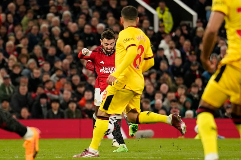 Bruno Fernandes hits a long-range shot to score Manchester United's third goal. AP