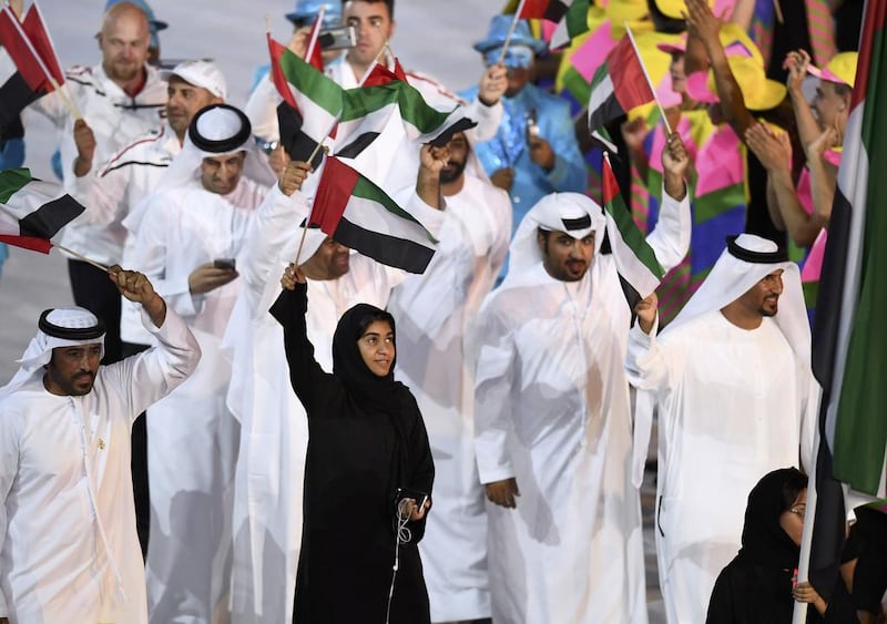 Flag-bearer Nada Al-Bedwawi of United Arab Emirates leads her contingent during the opening ceremony. Dylan Martinez / Reuters