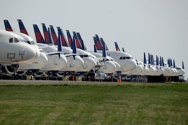 Dozens of mothballed Delta Air Lines jets are parked at Kansas City International Airport. The number of Americans getting on airplanes has sunk to a level not seen in more than 60 years as people shelter in their homes to avoid catching or spreading the new coronavirus. AP.