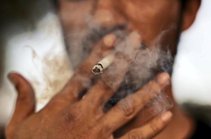 Tobacco-related diseases kill 6 million people each year, which will rise to more than 8 million by 2030. Christopher Pike / The National