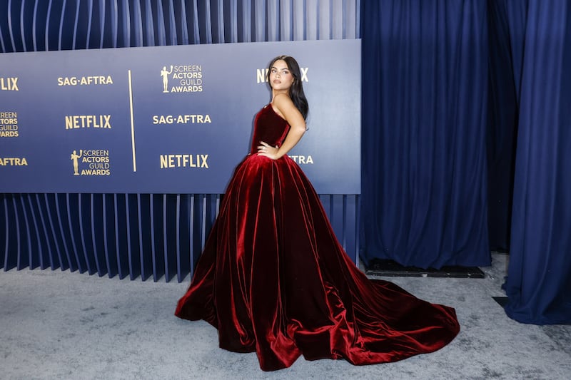 Ariana Greenblatt stunned in a strapless burgundy velvet Vera Wang princess ball gown. EPA