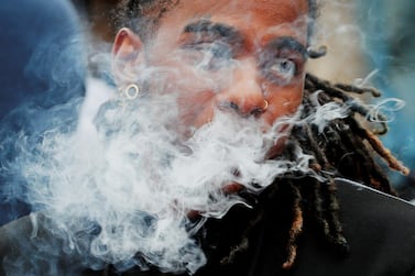 A demonstrator vapes during a protest at the Massachusetts State House against the state’s four-month ban of all vaping product sales in Boston, Massachusetts. Reuters 