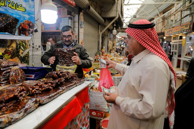 An Iraqi man shops at a wholesale market in preparation for Ramadan. Reuters