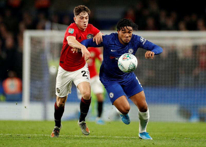 Manchester United's Daniel James, left, battles for possession with Reece James. Reuters