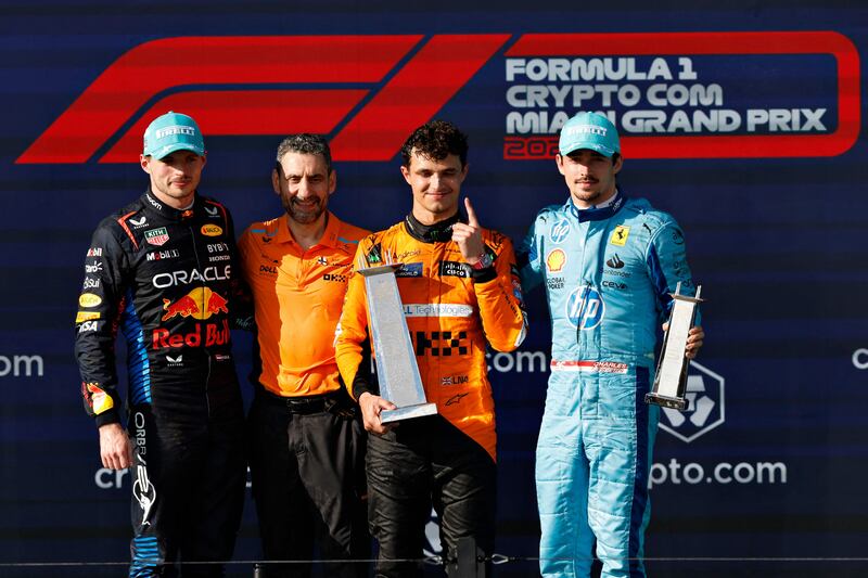 Lando Norris, runner-up Max Verstappen, third-placed Ferrari driver Charles Leclerc and McLaren Team Principal Andrea Stella on the Miami Grand Prix podium. AFP
