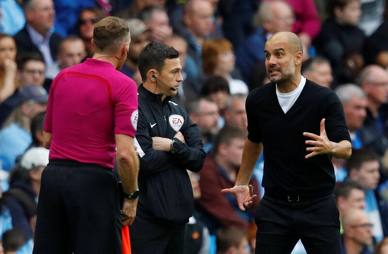 Manchester City manager Pep Guardiola remonstrates with referee Neil Swarbrick. Phil Noble / Reuters