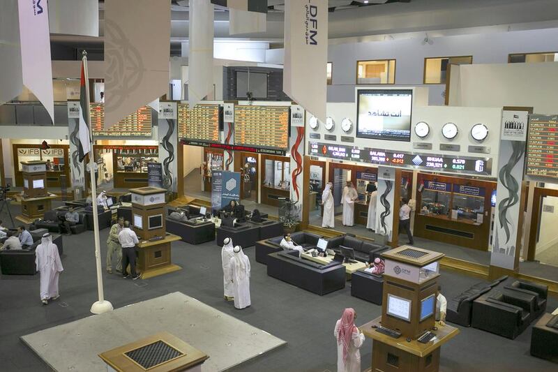 Anxious traders at the floor of Dubai Financial Market on Wednesday, December 17. Reem Mohammed / The National