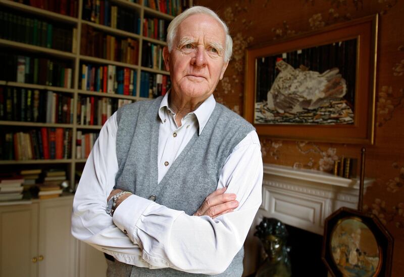 FILE - In this Aug. 28, 2008 file photo Author John Le Carre poses for a photo at his home in London. John le Carre, the spy-turned-novelist whose elegant and intricate narratives defined the Cold War espionage thriller and brought acclaim to a genre critics had once ignored, has died. He was 89, Le Carre's literary agency, Curtis Brown, said Sunday, Dec. 13, 2020 that he died in Cornwall, southwest England on Saturday. (AP Photo/Kirsty Wigglesworth, File)