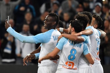 Marseille's Italian forward Mario Balotelli (L) takes a selfie with teammates after scoring during the French L1 football match between Olympique de Marseille and AS Saint-Etienne at the Velodrome Stadium in Marseille, southern France on March 3, 2019. / AFP / GERARD JULIEN