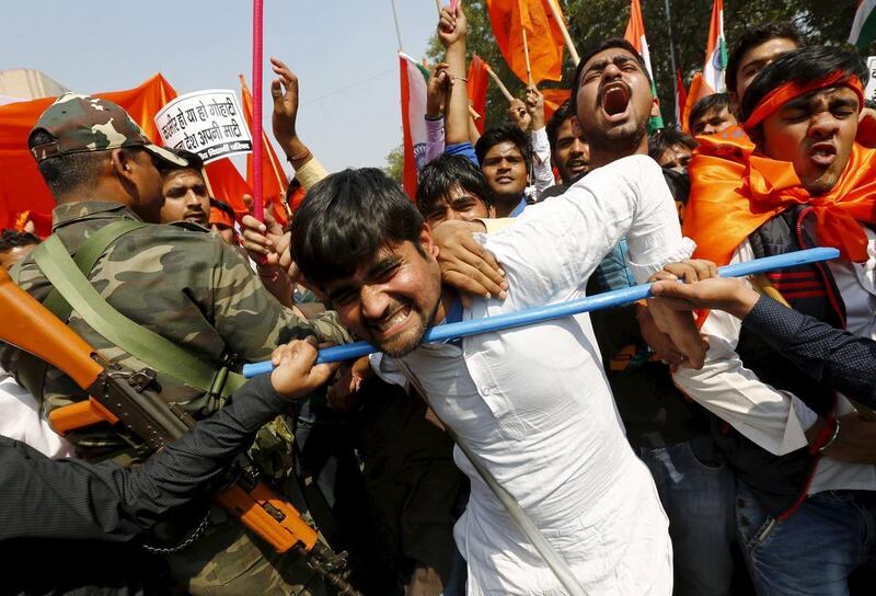 Activists from the Akhil Bharatiya Vidyarthi Parishad (ABVP), the student wing of India’s ruling Bharatiya Janata Party (BJP), scuffle with security personnel during a protest march in New Delhi. Adnan Abidi / Reuters