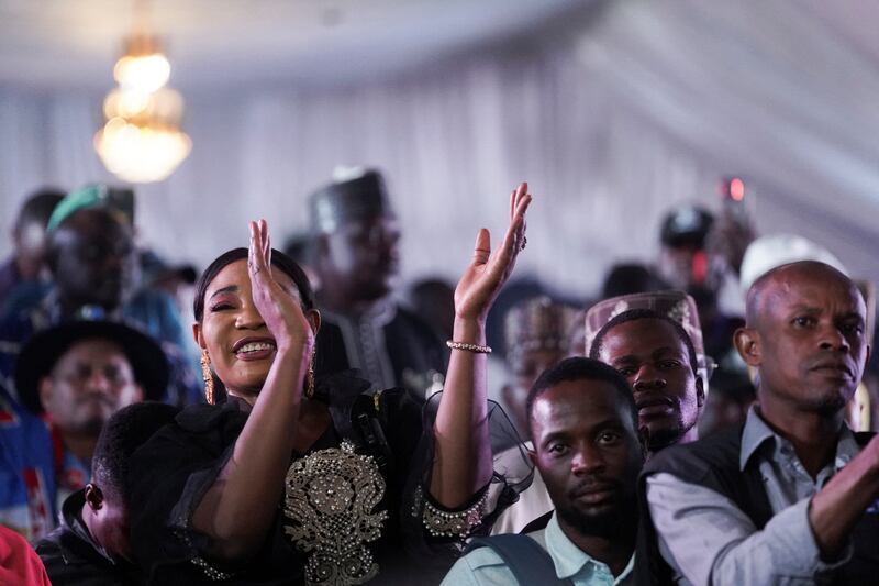 Supporters of Mr Tinubu celebrate after he was declared the winner, at the party's campaign headquarters in Abuja. Reuters