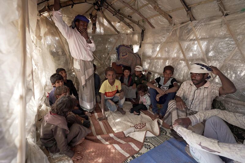 Yehya Hayba and his children, who fled fighting between Houthi rebels and government forces backed by a Saudi-led coalition, live at the Al Sumya camp for internally displaced people near Marib city, Yemen. AFP