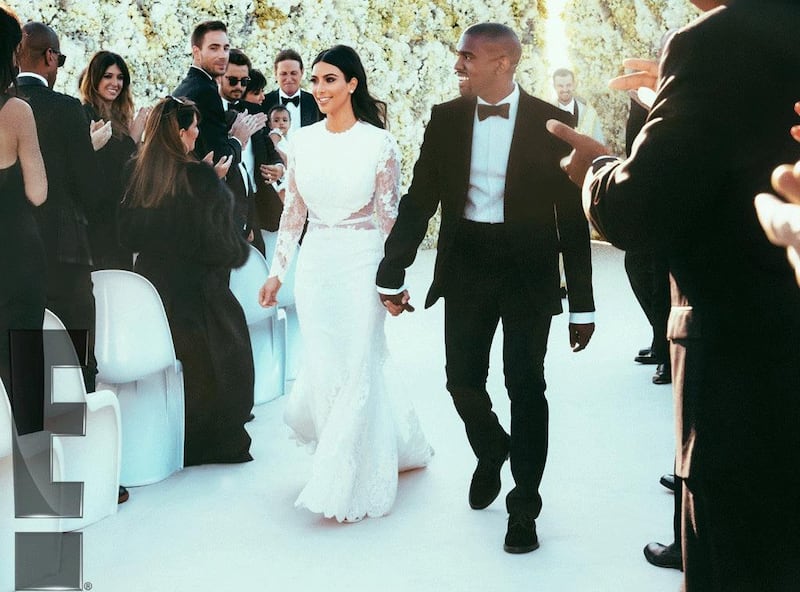 Kim Kardashian and Kanye West make their way down the aisle after their wedding on May 24, 2014, at Fort di Belvedere in Florence, Italy. Courtesy E! Entertainment Television