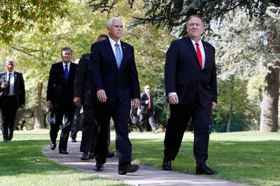 Vice President Mike Pence and Secretary of State Mike Pompeo, walk to a car to drive to a meeting with Turkish President Recep Tayyip Erdogan, in Ankara, Turkey, Thursday, Oct. 17, 2019. (AP Photo/Jacquelyn Martin)
