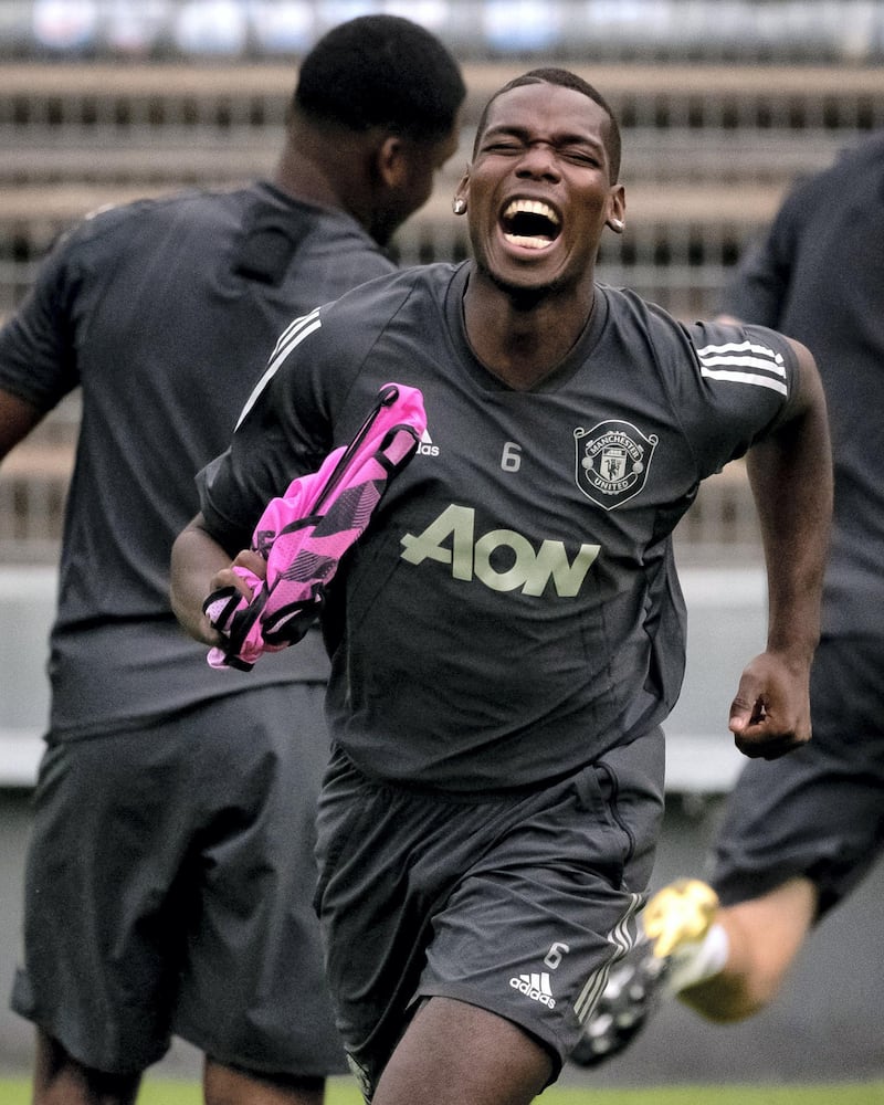 COLOGNE, GERMANY - AUGUST 15:  Paul Pogba of Manchester United  laughs during a training session at RheinEnergieStadion on August 15, 2020 in Cologne, Germany. (Photo by Ash Donelon/Manchester United via Getty Images)