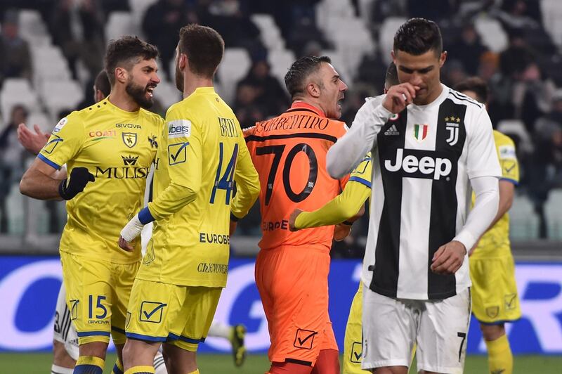 Chievo goalkeeper Stefano Sorrentino celebrates his penalty save against Cristiano Ronaldo. The save could not prevent Juventus winning the game 3-0. Getty