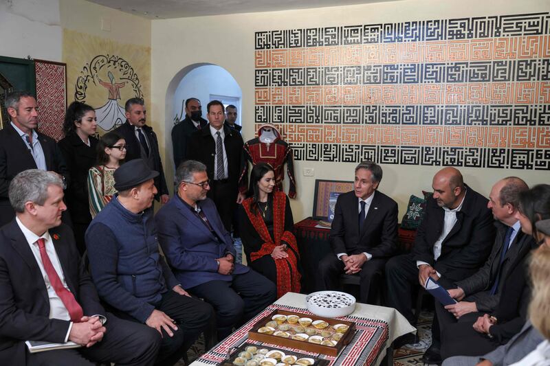 Mr Blinken, centre, meets representatives of Palestinian civil society in Ramallah. AFP