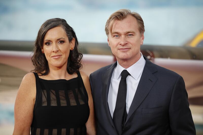 British director Christopher Nolan and his wife Emma Thomas pose for a photograph upon arrival for the world premiere of "Dunkirk" in London on July 13, 2017. (Photo by Tolga AKMEN / AFP)