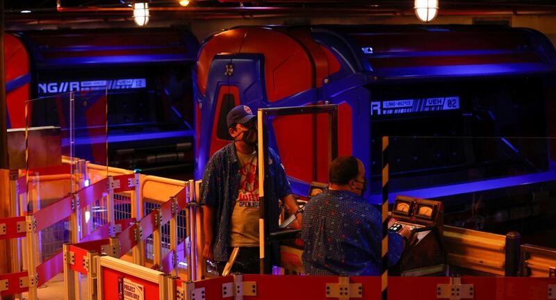 Operators separated by plexiglass partitions are pictured inside Web Slingers: A Spider-Man Adventure ride ahead of the opening of the Avengers Campus. Reuters