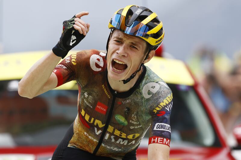 Danish rider Jonas Vingegaard celebrates as he crosses the finish line to win Stage 11 at Col du Granon. EPA
