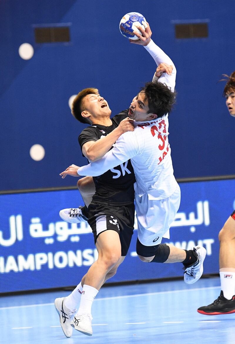 Yuto Agarie (R) of Japan in action against Min Ho Ha (L) of South Korea in action during the 19th Asian Men's Handball Championship semi final match between Japan and South Korea in Kuwait City.  EPA