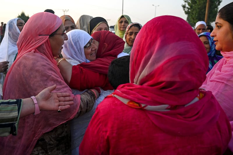 A pilgrim in Srinagar, Kashmir, is embraced by her relatives before leaving for the annual Hajj pilgrimage. AFP