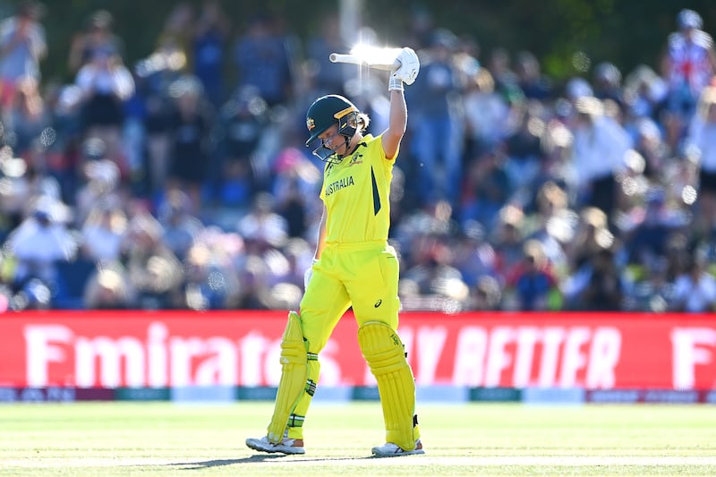 Alyssa Healy raises her bat in celebration after reaching 150 runs during the 2022 Women's Cricket World Cup final. Getty
