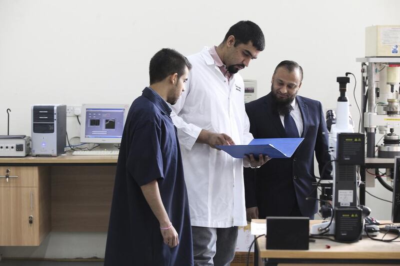 Dr Rehan Ahmed, right, of Heriot-Watt University is excited for the Dubai school’s new PhD programme. He is pictured with undergraduate Moein Zaman, left, and doctoral candidate Omar Ali. Lee Hoagland / The National