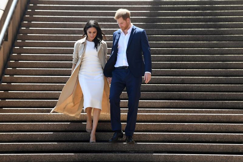 Meghan, Duchess of Sussex, wears a Karen Gee dress, Martin Grant trench and Stuart Weitzman heels at the Sydney Opera House in Sydney, Australia, on October 16, 2018. Reuters