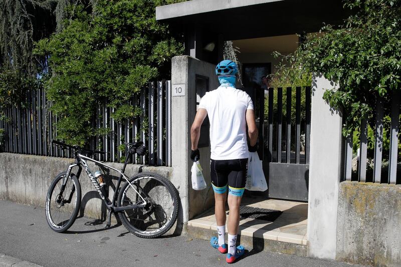 Davide Martinelli delivers medicine to a resident in Rovato, near Brescia, Northern Italy. AP Photo