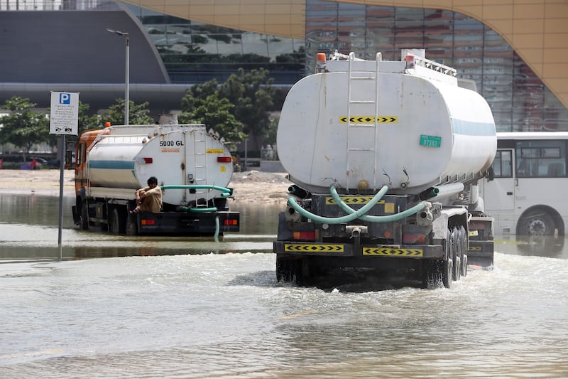 Tankers clearing waterlogged roads near Discovery Gardens metro station in Dubai on April 22. Pawan Singh / The National