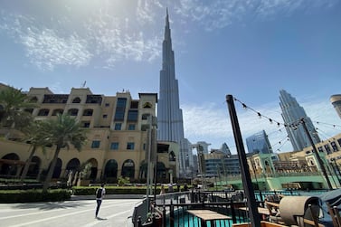 People walk outside Dubai mall after the UAE government eased a curfew and allowed stores to open, following the outbreak of Covid-19. Dubai recorded 1,824 property sales transactions worth more than Dh3.62 billion in April amid lockdown measures. Reuters