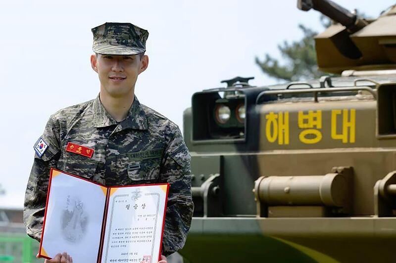Son Heung-min poses with a prize during a basic military training completion ceremony at a Marine Corps boot camp in Seogwipo on Jeju Island.