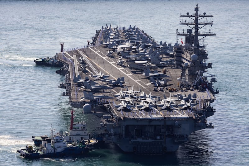 The USS Ronald Reagan, a Nimitz-class aircraft carrier and part of the US Navy 7th Fleet, approaches the naval base in Busan, South Korea. Bloomberg