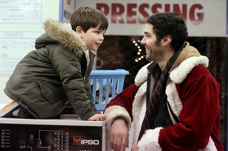 Tahar Rahim as Santa Claus and Victor Cabal as the kid who wants to be his apprentice in the film Le Père Noël (Santa Claus). Courtesy Quad Productions