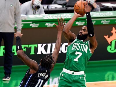 Jan 15, 2021; Boston, Massachusetts, USA; Boston Celtics guard Jaylen Brown (7) attempts a basket against Orlando Magic forward James Ennis III (11) during the third quarter at TD Garden. Mandatory Credit: Brian Fluharty-USA TODAY Sports