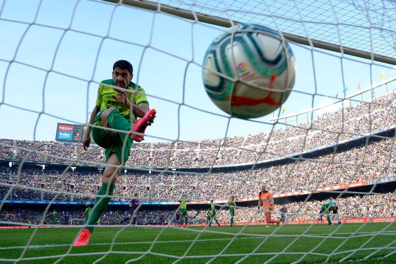Eibar's Spanish defender Jose Angel reacts after  Barcelona's Argentine forward Lionel Messi scored a third goa. AFP