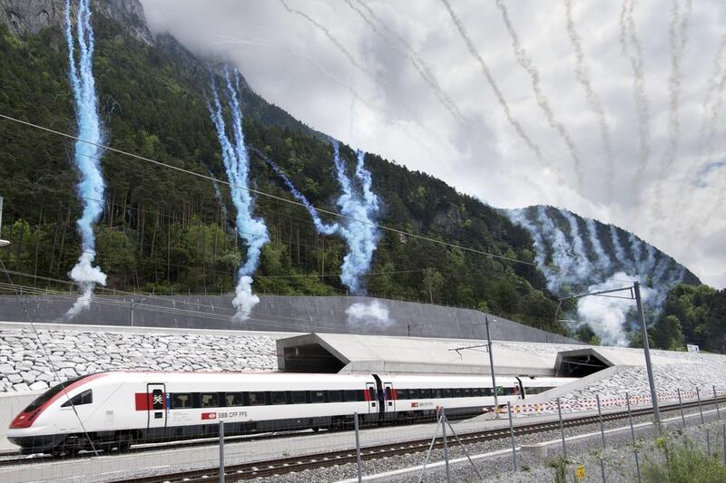 Fireworks are set off in celebration as the first train comes out of the of the Gotthard Base Tunnel on opening day. Laurent Gillieron / EPA