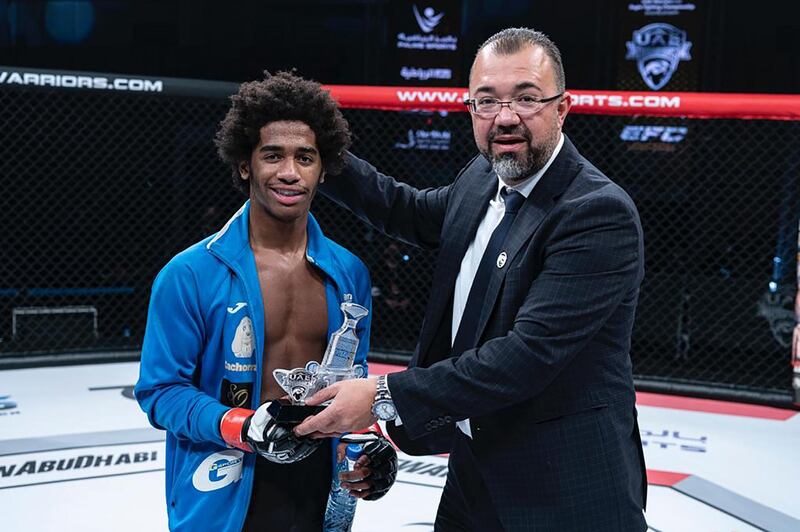Portuguese Leandro Gomes receives his award from Palms Sports managing director Fouad Darwish after his win against Moroccan Mohamed Karim in the Catchweight 64kg in the UAE Warriors 15 at the Jiu-Jitsu Arena on Friday, January 15, 2021. Courtesy UAE Warriors
