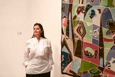 Selma Feriani with a tapestry by Amina Saoudi. Khushnum Bhandari / The National