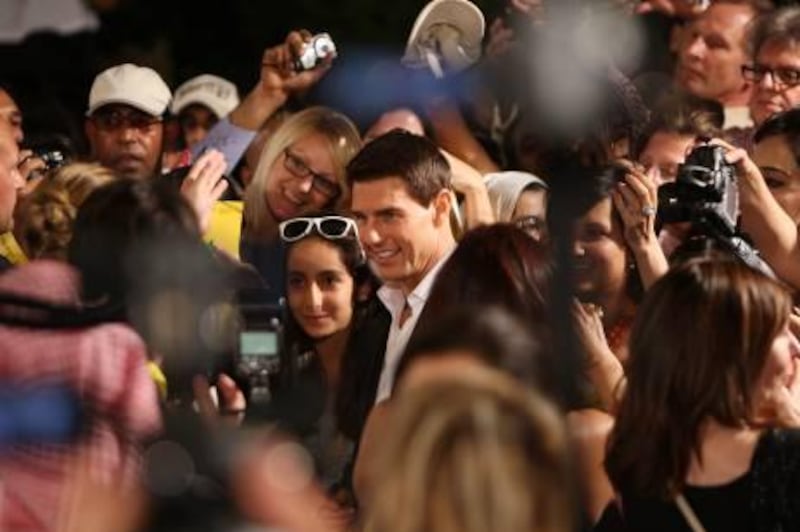DUBAI , UNITED ARAB EMIRATES Ð Dec 7 : Fans taking pictures with Tom Cruise star of Mission : Impossible - Ghost Protocol at the Red Carpet during the opening night of 8th Dubai International Film Festival at Madinat Arena in Madinat Jumeirah in Dubai. ( Pawan Singh / The National ) For News. Story by Alex Ritman
