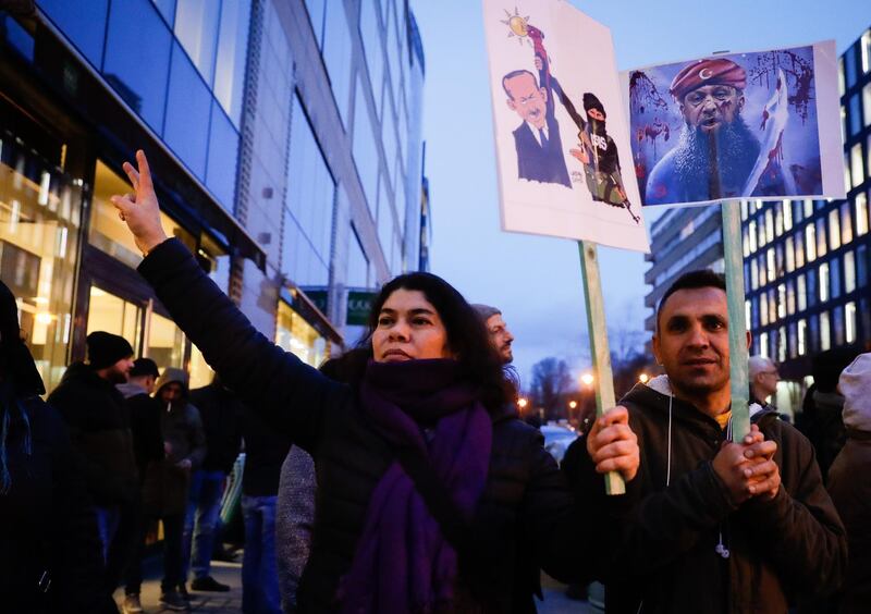 People gather to demonstrate against the arrival of Turkish President Erdogan in Brussels.  EPA
