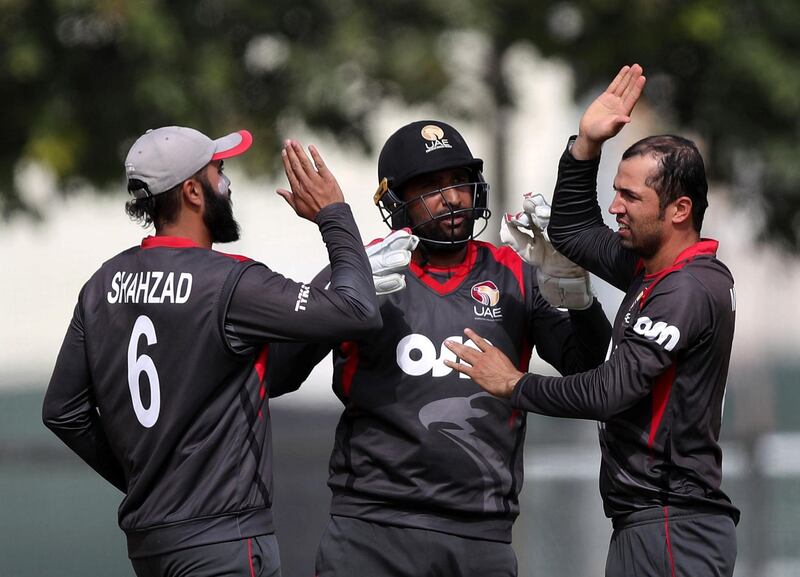 Dubai, United Arab Emirates - January 21st, 2018: UAE's Rohan Mustafa picks up the wicket of Scotland's George Munsey during the match between the UAE and Scotland. Sunday, January 21st, 2018 at ICC Academy, Dubai. Chris Whiteoak / The National