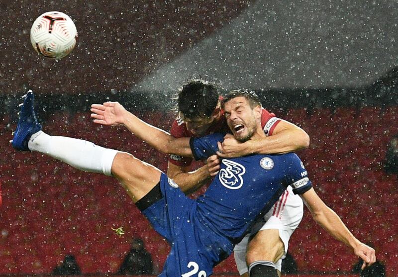 Manchester United's Harry Maguire tussles with Chelsea's Cesar Azpilicueta in the area during the 0-0 draw at Old Trafford. No penalty was given after a VAR review. Reuters